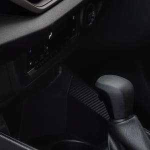 Interior view - car's dashboard with a touchscreen infotainment system and a steering wheel.