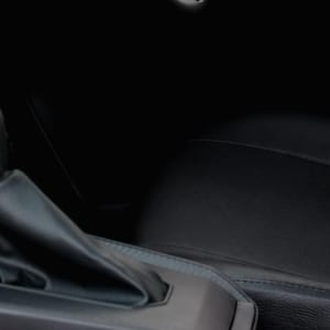 Close-up of the dashboard, gear shift, and passenger seat.