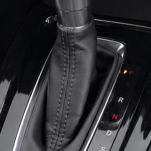 Interior view of Honda HRV center console with automatic gear shift and climate controls.