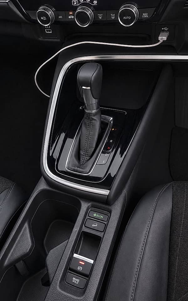 Interior view of Honda HRV center console with automatic gear shift and climate controls.