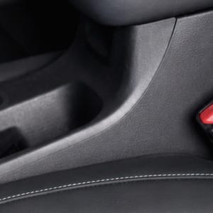 Close-up of a car's center console and armrest.