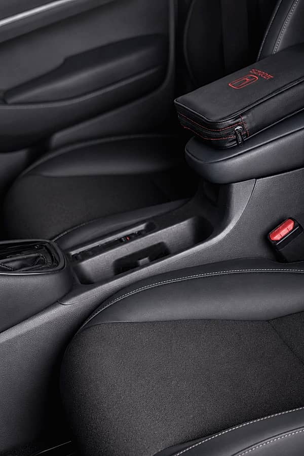 Close-up of a car's center console and armrest.