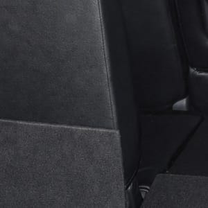 Black car's spacious and clean trunk with folded-down rear seats for maximum cargo capacity.