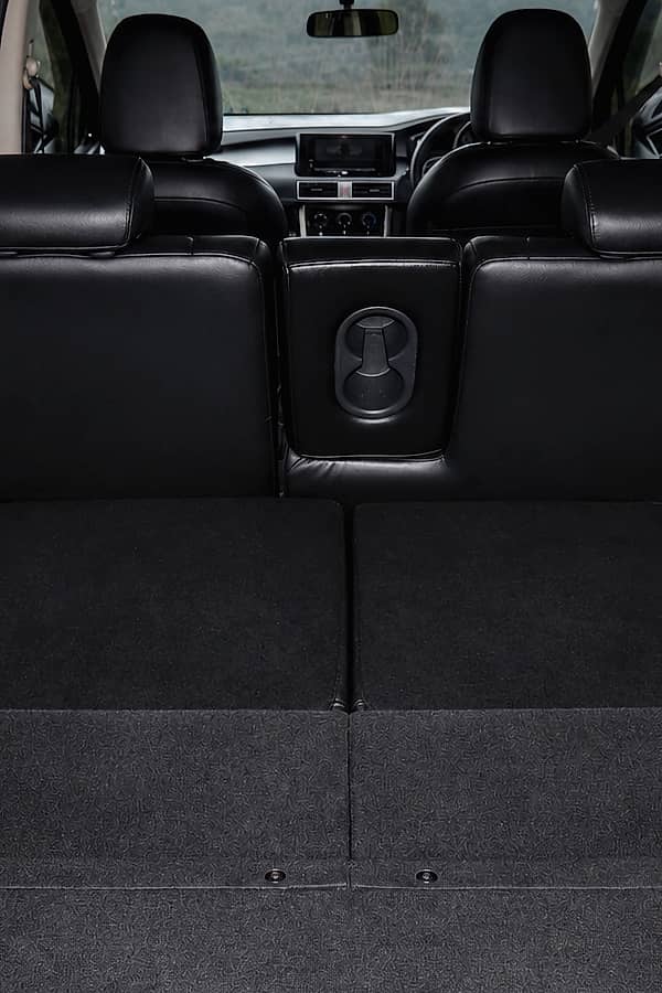 Empty car trunk with folded down rear seats.